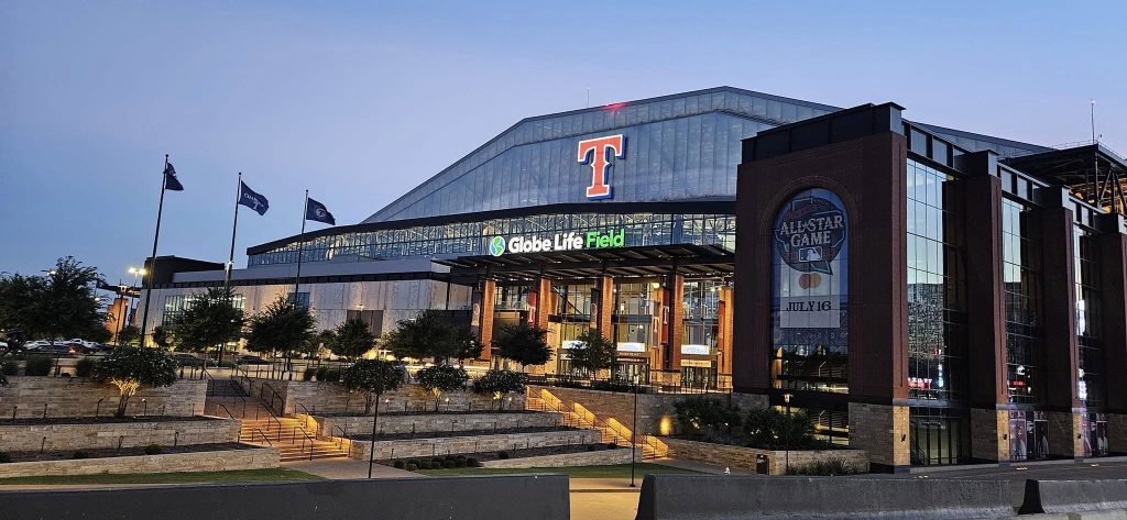 Globe Life Field in Arlington, Texas, lit up at dusk