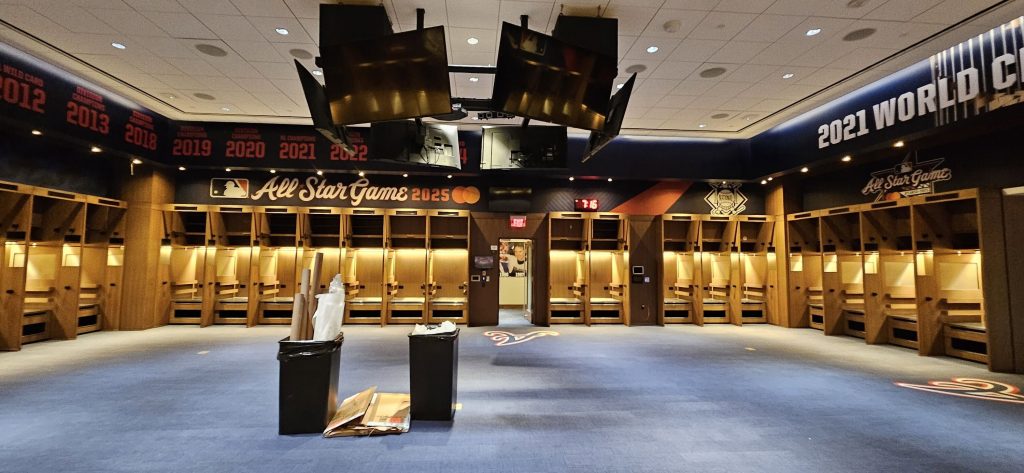 Locker room with custom wall graphics and championship lettering